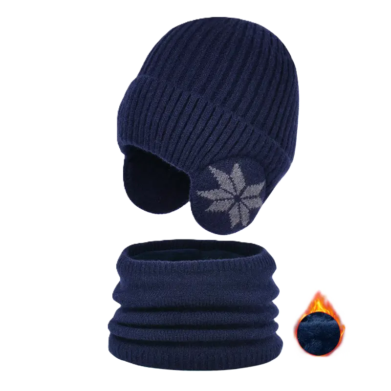 Cagoule enfant en tricot bleu marine avec cache-oreilles décorés d’un motif flocon, assortie d’un cache-cou. Illustration d’une doublure chaude et isolante avec une flamme pour indiquer la résistance au froid.