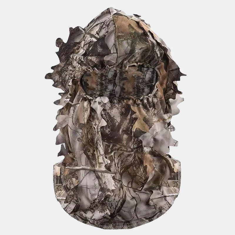 Cagoule filet camouflage intégrale avec motif réaliste de feuilles et de branches, conçue pour une discrétion maximale dans les environnements naturels. Idéale pour la chasse, l'observation de la faune ou les activités d'airsoft en plein air