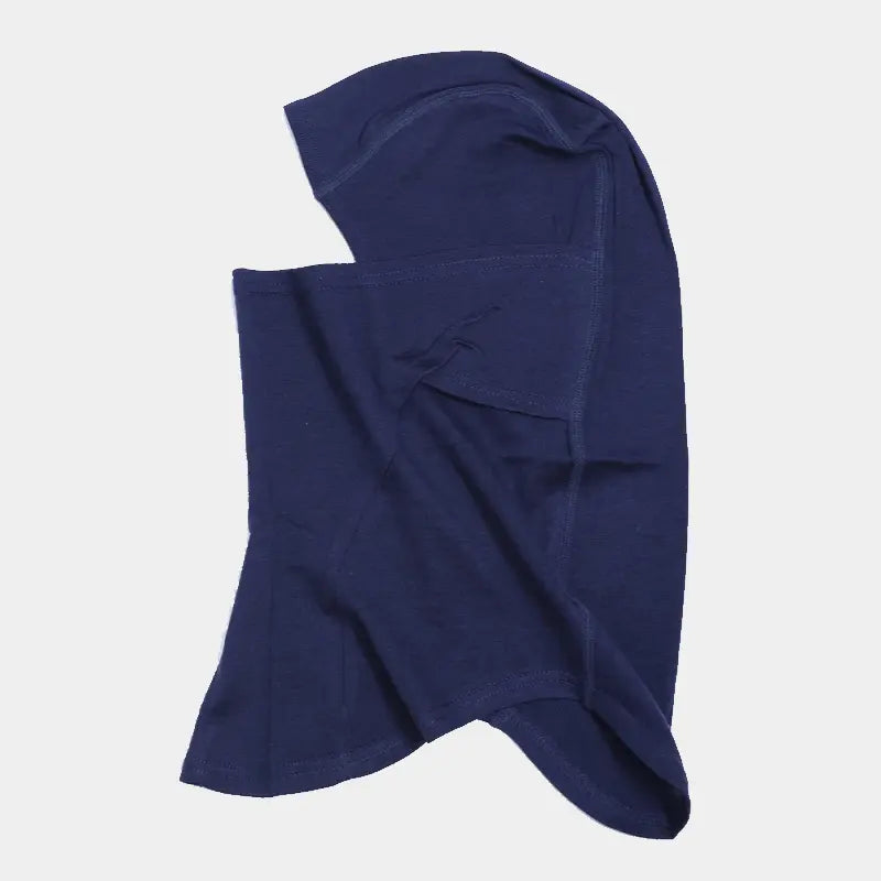 Cagoule en laine mérinos bleue vue latérale, alliant esthétique et performance thermique pour les climats froids.