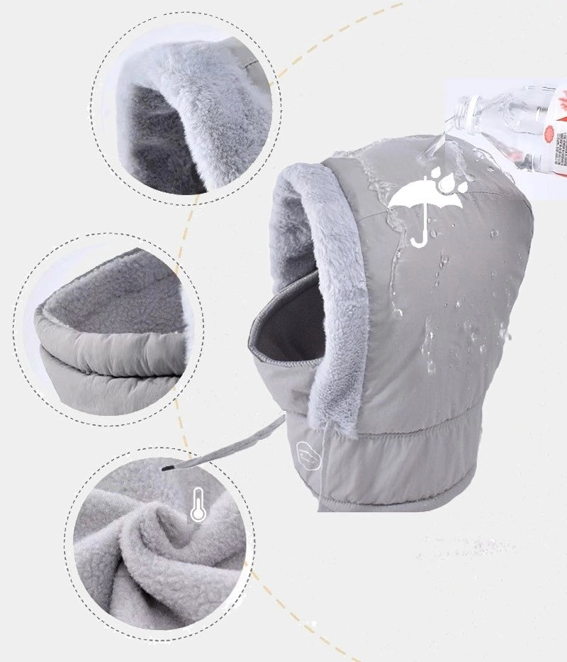 Cagoule ski femme waterproof grise avec doublure polaire douce et chaude, mettant en évidence son tissu imperméable résistant à l'eau, son design ergonomique et ses propriétés isolantes idéales pour l'hiver.