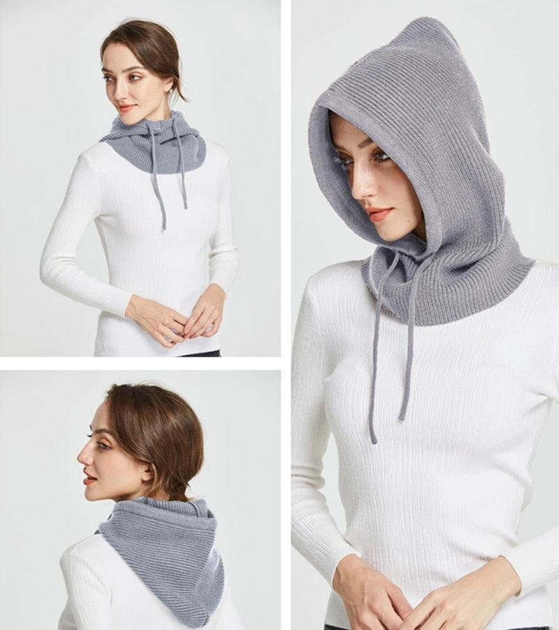 Femme portant une cagoule tricot grise polyvalente, avec un design élégant et moderne, parfait pour l'hiver.