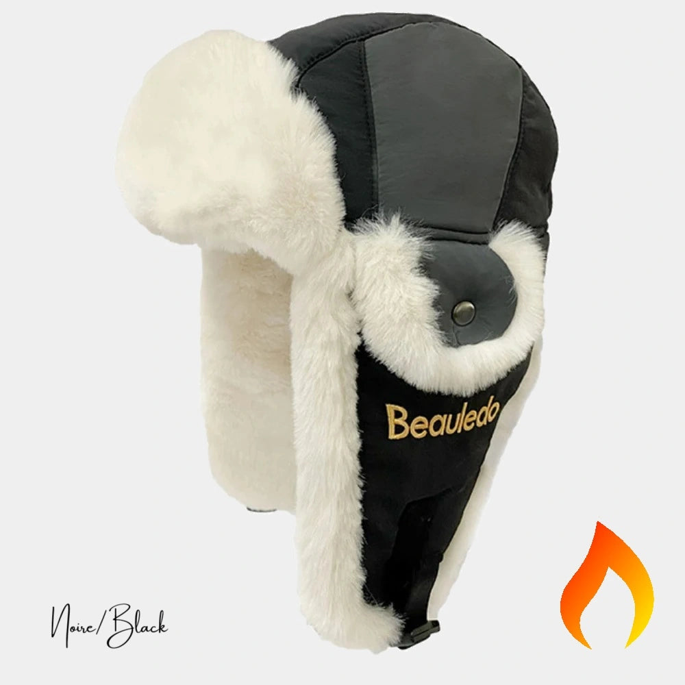 Chapka Aviateur Femme noir avec doublure en fausse fourrure blanche, logo "Beauledo" brodé sur le côté. Un accessoire d’hiver élégant et chaud, idéal pour affronter le froid avec style et confort.