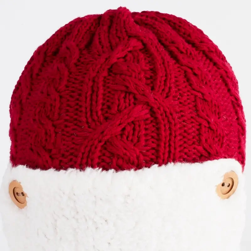 Zoom sur la torsade de la Chapka Enfant Tricot rouge avec une texture en maille torsadée et une doublure polaire ultra chaude.